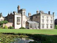 Property developers who starred on Channel 4 show are accused of carrying out illegal building work at Grade II listed Gothic mansion