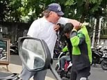 'Drunk' Aussie tourist sporting a mullet sparks outrage after brawling with a local driver in Bali over a hat