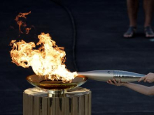 Slovesnost predaje olimpijskega ognja Italiji skrajšana