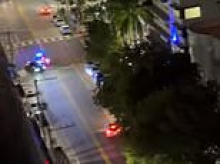 Moment stolen $400,000 Ferrari smashes into utility pole during high-speed police chase as crash causes major electrical blast