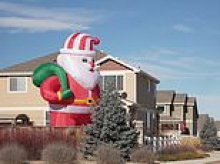 Christmas miracle as sleepy suburban village DEFEATS heartless Grinch over giant inflatable Santa Claus