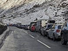 Police blast Instagram tourists for their 'dangerous parking' on snow-covered Welsh mountain as Britain counts cost from deadly Storm Goretti - with warnings more chaos is on the way