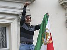 Dissidents remove Iranian flag from embassy and burn pictures of Ayatollah Khamenei as thousands protest in the UK and around Europe against the regime