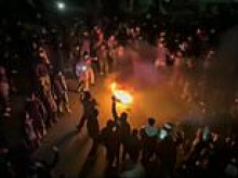 Chilling warning to Iran over Trump's 'locked and loaded' threat as regime defies him and kills 50 protesters