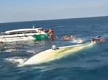 One dead after tourist speedboat crash throws 55 people into the sea off Thailand leaving them clinging to each other to stay afloat
