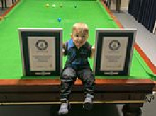 Snooker prodigy, two, lands Guinness World Records by becoming the youngest person to nail TWO trick shots