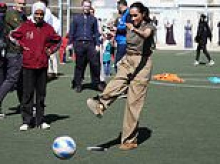 Bend it like Meghan! Duchess celebrates scoring a goal against a child - and proves she's a match for Kate when it comes to playing the beautiful game