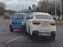 Moment BMW smashes into Hyundai as drivers get their roundabout lanes mixed up - but who is in the wrong?