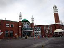Counter-terror cops investigate after man 'carrying axe and knife' walks into Manchester mosque during Ramadan - as manhunt continues for second suspect and police increase patrols