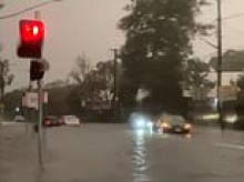 Dangerous flash flooding hits Sydney with commuters trapped in gridlock for hours