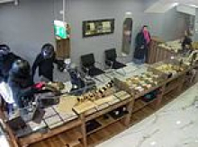 Terrifying new video shows moment machete-wielding thieves smash their way into jewellers on a moped before going on theft spree - as brave passers-by confront them