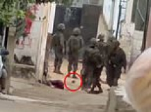 Israeli troops are accused of shooting Palestinian boy then 'planting evidence' as he bled to death - as IDF insists teen was a 'terrorist posing immediate threat'