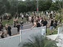 Chaos as 500 teenagers gatecrash party as riot squad and police helicopter are called in - while shocking footage shows boy being crash tackled to the ground by cops