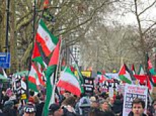 Leftist demonstrators chant 'victory to Iran' as thousands march on US Embassy in London demanding an end to the bombing