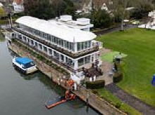 Murder probe launched after woman is found dead by private member's club on River Thames: Police arrest man, 44