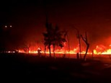 Moment fire flows through the streets of Tehran in apocalyptic scenes after after US strikes on oil depots