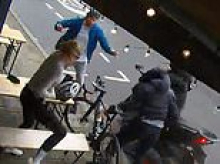 Moment brazen knife-wielding thief grabs woman's £5,000 bike from London coffee shop before police show up - but only to buy a round of drinks