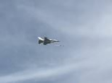 Dogfight over Dubai: Incredible moment UAE fighter jet chases and fires at Iranian Shahed drone as beachgoers watch-on from below