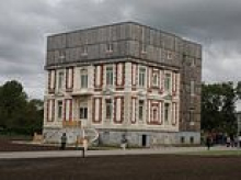 Outcry in France after famed chateau is converted into council flats 'monstrosity' with timber-cladding box roof