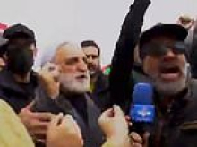 Iranian official continues anti-Israel rant at pro-regime rally - even ignoring IDF missile exploding in background and declaring 'our people are not afraid of bombing'