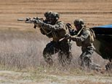 Trump deploys 5,000 Marines into Hormuz tinderbox as boots on the ground fears grow after 13 US troops die in Iran war carnage