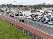 The £17million 'white elephant' cycle lane everyone loves to hate: Council builds 11ft-wide track with just three problems - it causes traffic jams, looks ugly and no one uses it