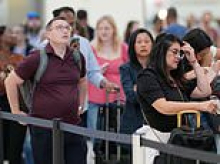 Claustrophobic fliers suffering panic attacks while waiting in dank underground tunnel at Houston Airport, as TSA wait times came close to FIVE HOURS