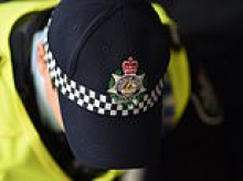 Two teens charged with accessing violent extremist material - as cops allegedly seize a ballistic vest and notebooks from a home in Moree