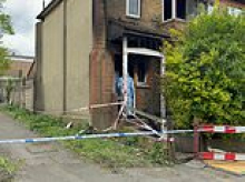 Man, 25, charged with murder after two die in house fire in north London