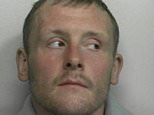 Manhunt underway for prisoner who fled from transport van with no shoes and a handcuff on his wrist after appearing in court on assault charge