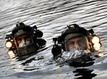 Elite team of Royal Navy divers on standby to deploy to the Strait of Hormuz to help defuse Iranian mines blocking shipping lanes