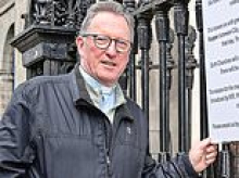 They've been doing it since the mid-1800s... but now this church has been told that advertising their mass times on their protected railings is against planning rules. But they're not taking the barmy ruling lying down...