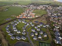 Revealed: Seaside village which banned new holiday homes is now split with two estates