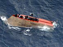 More than 70 migrants feared dead after crammed small boat capsizes off the coast of Libya