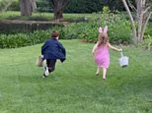 Sussexes at Easter: Meghan shares rare glimpse of Archie and Lilibet at home in US as they decorate eggs and feed chickens while royals attend Easter Sunday service in Windsor