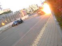 Moment Iran missile lands yards away from Israeli woman, who is knocked to the floor but miraculously manages to walk away