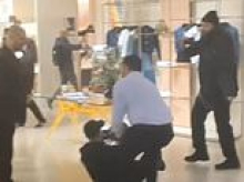 Moment animal rights activists storm Louis Vuitton London store with signs and bull horns over fur use