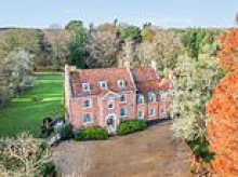 Huge 11-bedroom Georgian manor house goes on the market for £2.25 million in Norfolk - but the wealthy new owner will have an even grander neighbour