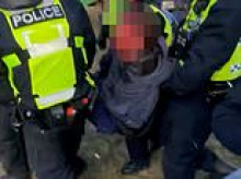 Moment illegal raver is left bloodied and battered after police beat him to the ground - as cops insist THEY were attacked with bottles and gave a 'proportionate response'