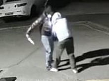 Moment knifeman with huge blade lunges at victim  on quiet residential London street