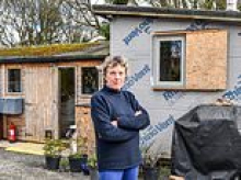 Couple are forced to live in garden shed for FOUR years as plans to build dream £370,000 eco-home are blocked by pollution in a river 12 miles away