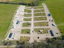 Traveller families move in after Easter holiday land grab: Up to a dozen caravans set up illegal camp after concreting over village field during four day weekend