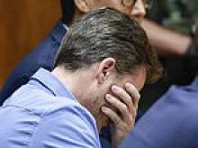 Top doctor breaks down as he's found guilty of attempted manslaughter for trying to push wife off cliff in Hawaii