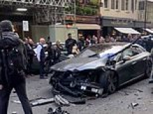 Moment man is arrested after 'crashing stolen car into pedicab as it was being chased by police' in packed Soho