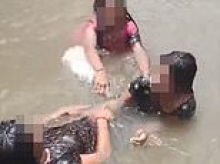 Three teenage girls are seen laughing and playing in waterfall before slipping on rocks and drowning in India