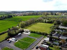 Villagers in year-long fight to close traveller site after bank holiday land grab: Residents' fury after family moved onto horse's field overnight, set up camp - and are refusing to leave