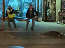 Terrifying moment woman strolling down NYC street is suddenly struck by falling fence