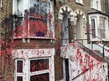 'Chinese gang turf wars' could be behind red and black paint attacks on row of houses across Britain that have left residents 'traumatised'