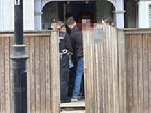 Afghan asylum seeker is arrested for 'harassing schoolgirls' after migrants were moved into £500,000 home in leafy Surrey village without telling residents