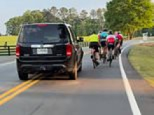 Terrifying video shows why Honda driver was charged with assault after encountering large group of cyclists pedaling down road